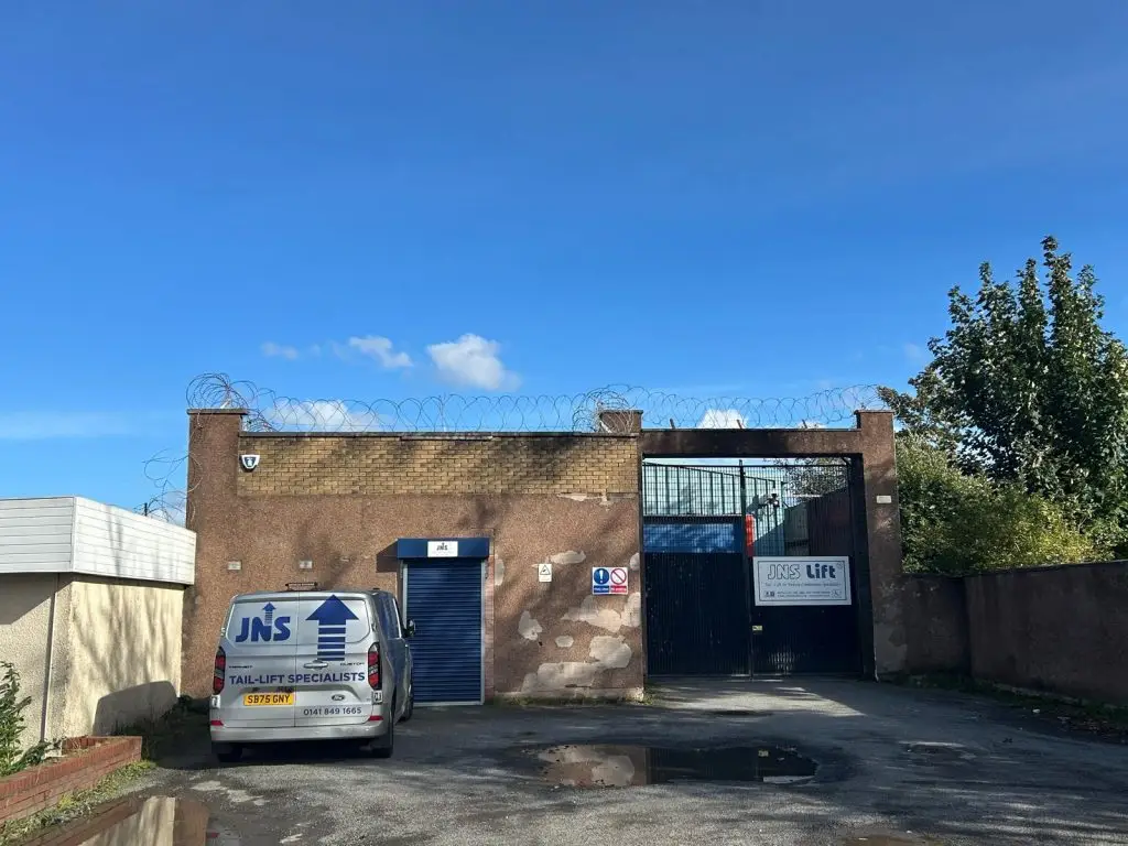 image is of commercial business premises getting gutters cleaned out by renfrewshire gutter services