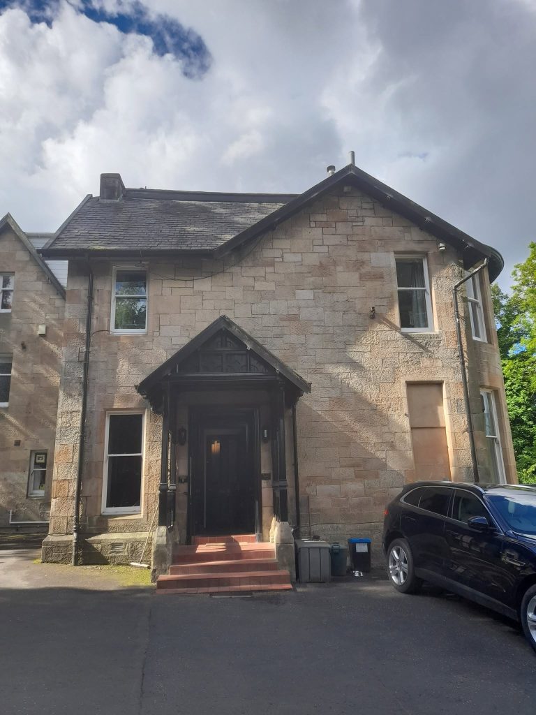 image of a sandstone villa type of property in Giffnock